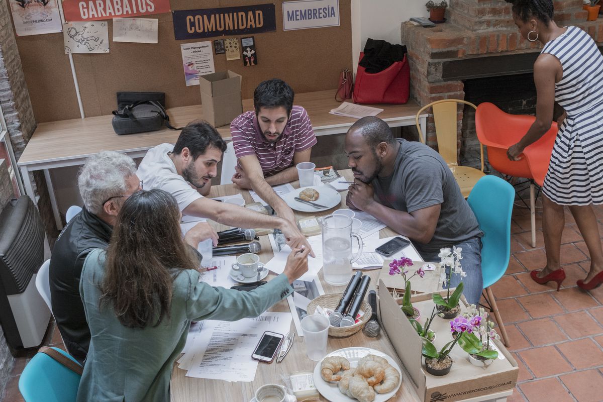Judges deliberating around a table