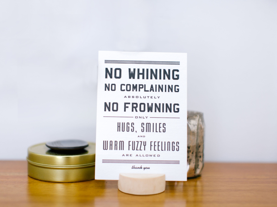 Sign that says "No whining, no complaining, absolutely no frowning, only hugs, smiles, and warm and fuzzy feelings allowed. Thanks.