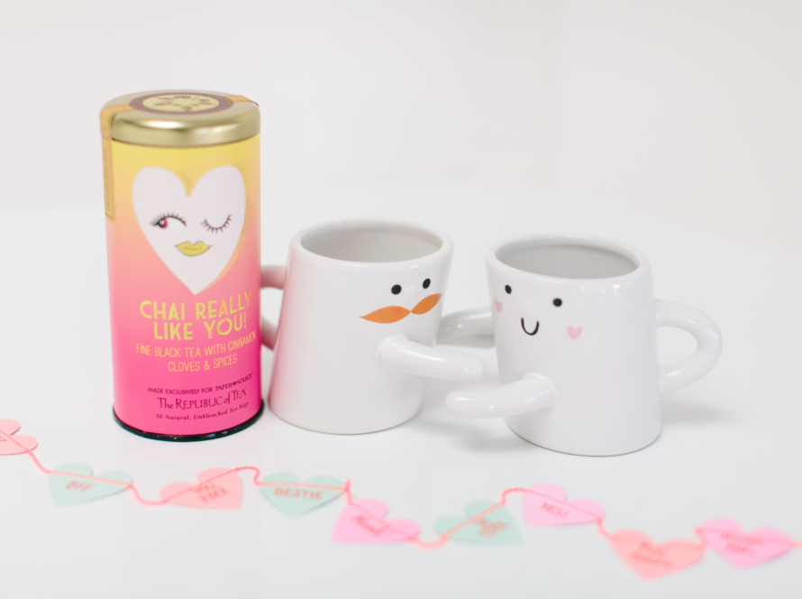 In the image, we can see two cups representing a man and a woman who are embracing each other and a taller, more colorful can.