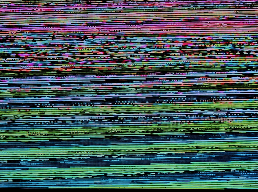 Colored horizontal lines that look like they are on an incline on a digital screen. They represent a glitch like you see when a channel doesn't have signal or is malfunctioning. It represents the glitch in modern marketing.