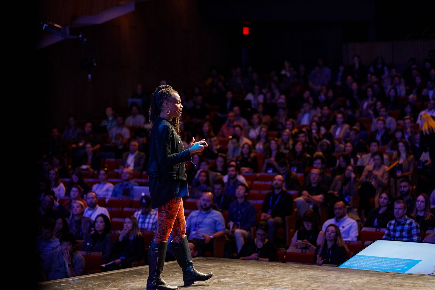 Sonia Thompson delivering a keynote to a full auditorium